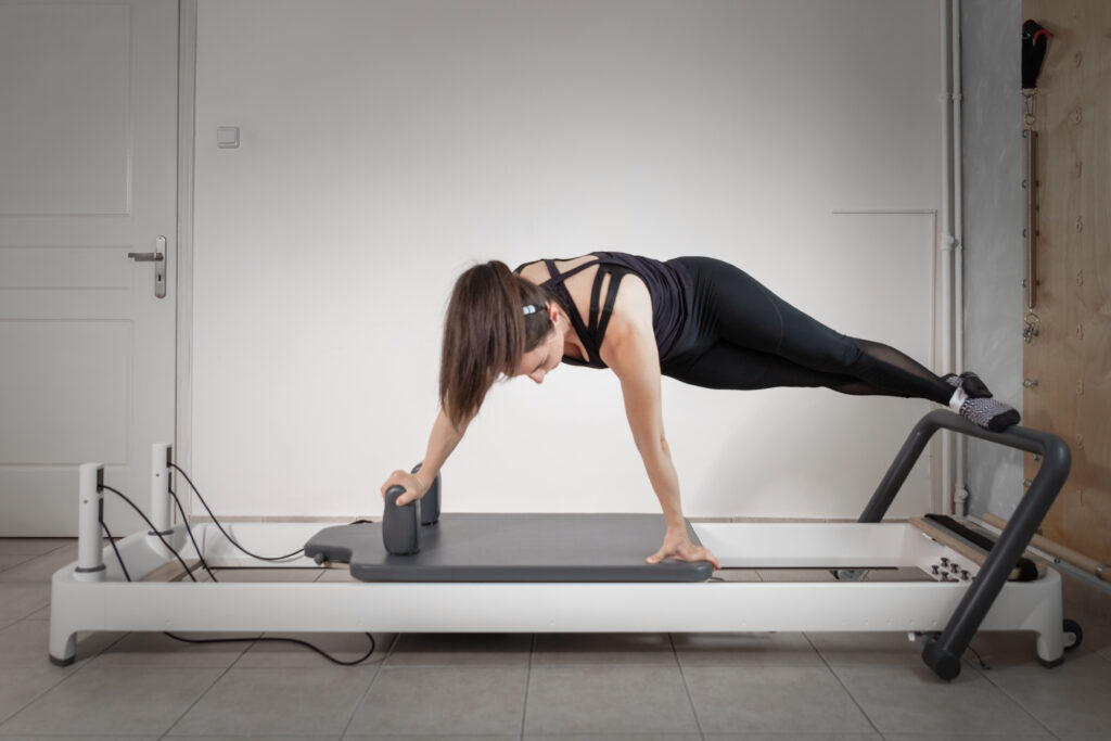 Woman on a Pilates reformer