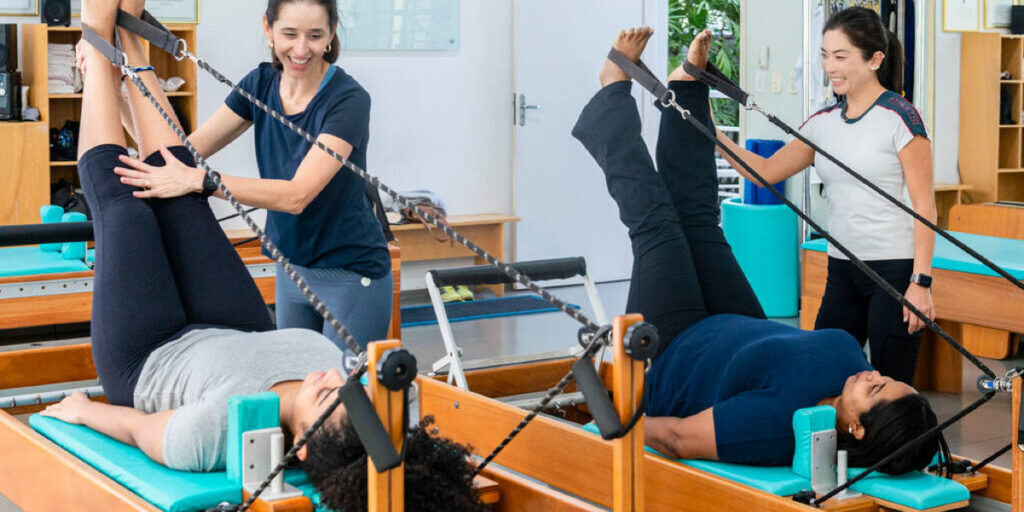 Being taught how to use a Pilates Reformer