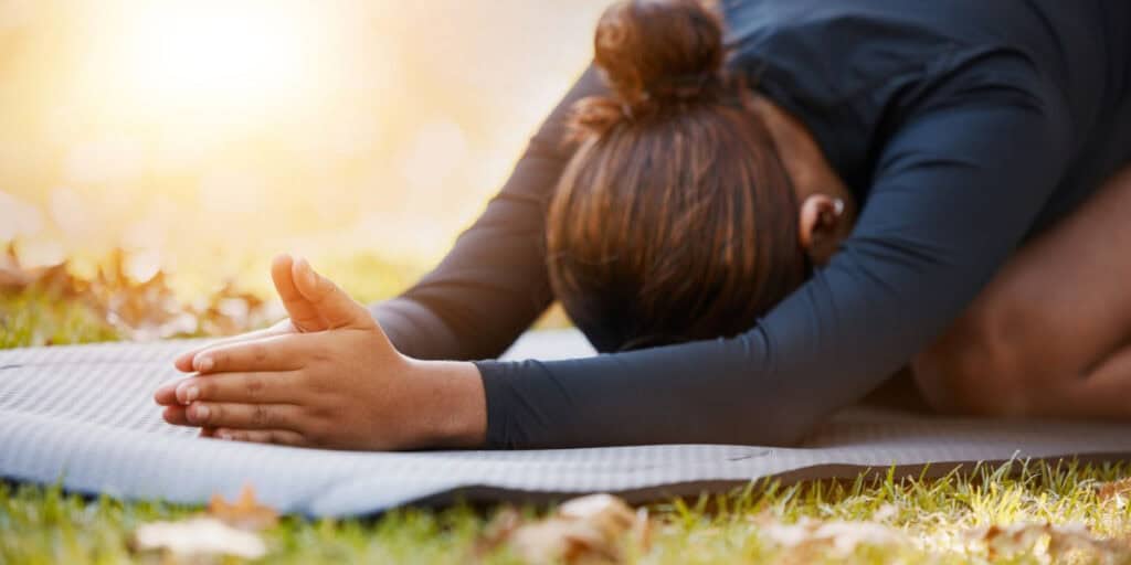 woman doing pilates outside