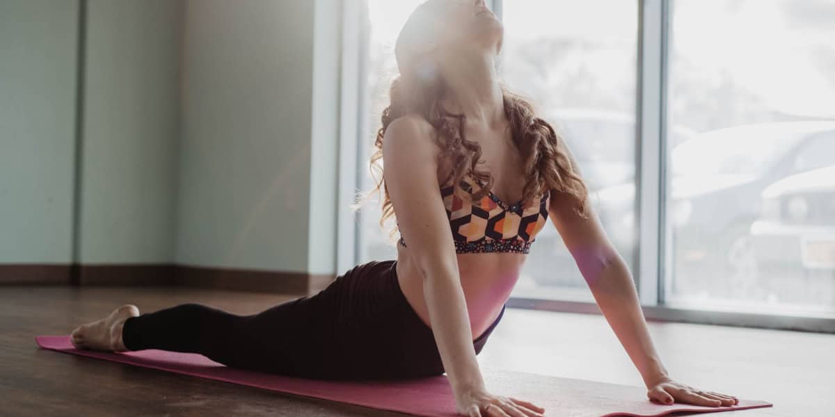 woman doing cobra pose