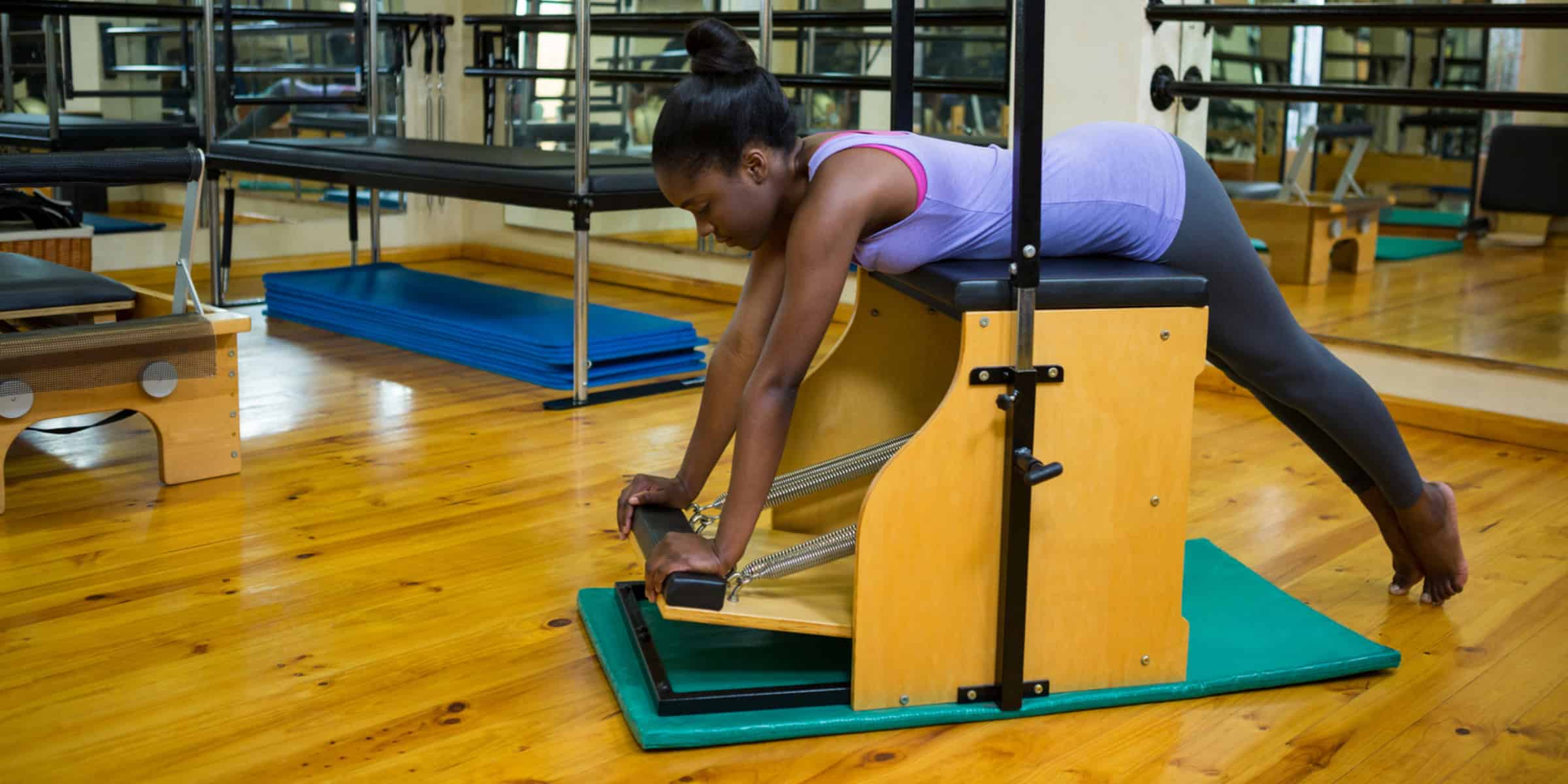 woman using pilates chair