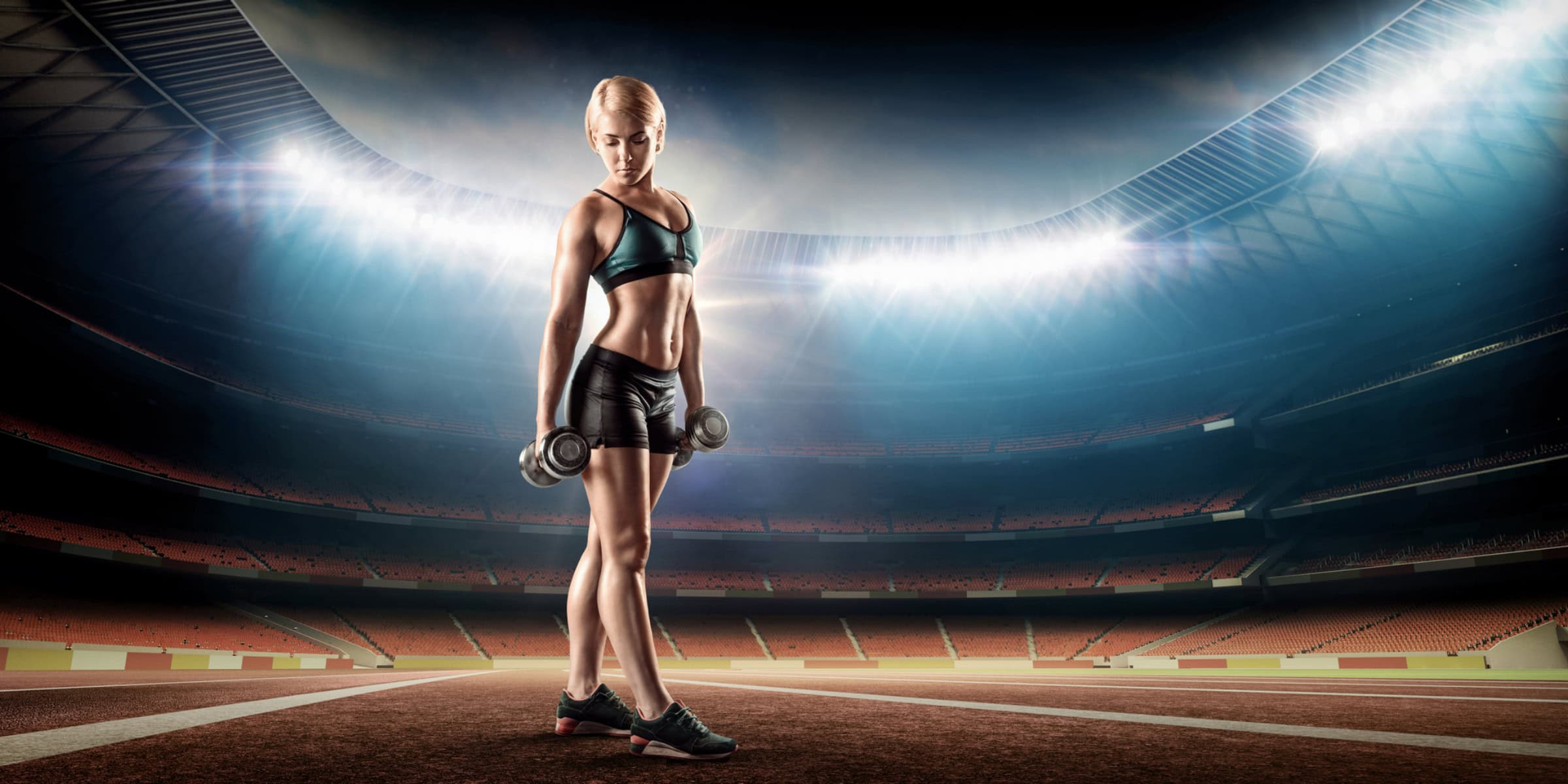 A woman standing in a stadium.