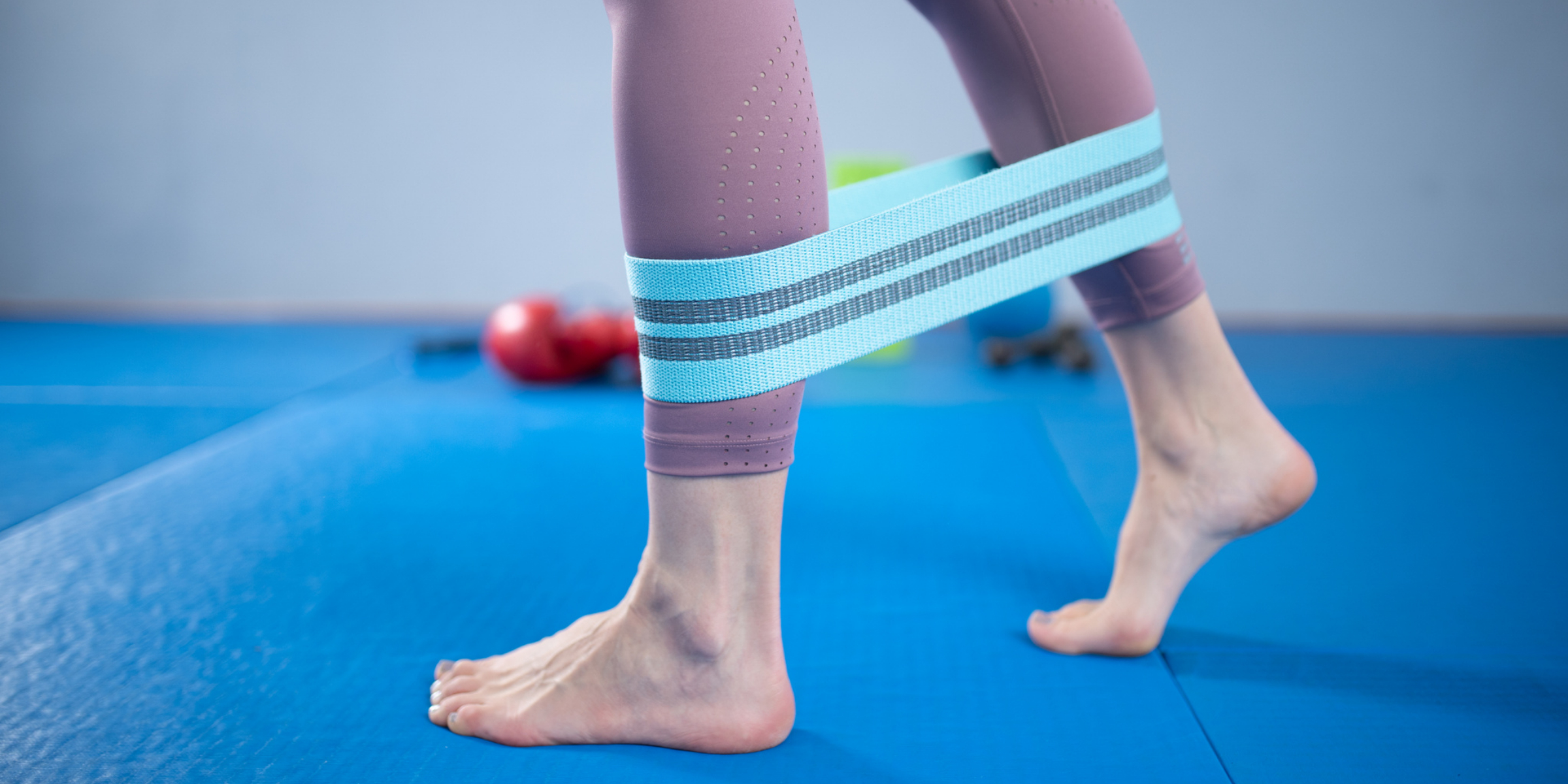 A woman's legs with a blue band around them.